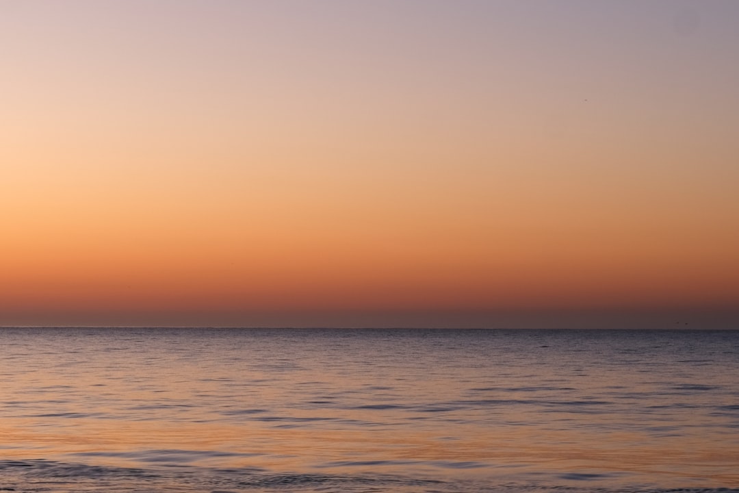 sunset over ocean water
